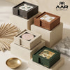 Collection of decorative boxes with AAR branding on a neutral background